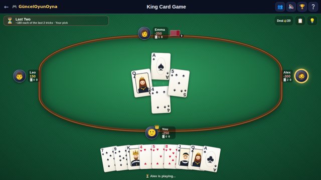 King card game: a trick on the green felt table and a fanned hand